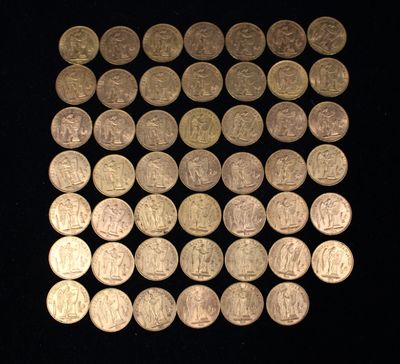 a lot of coins that are on a black surface