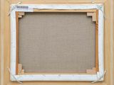 an image of a picture frame with a piece of fabric taped around it