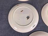four plates that have been left on the table