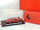 the red ferrari model is in a red box next to a red box