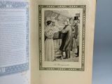an open book with a drawing of a man and a woman standing in front of a map