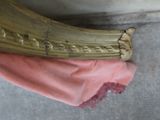 a banana sitting on a pink cloth on the floor
