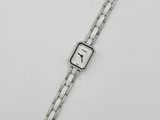 a close up of a watch on a white surface with a white background
