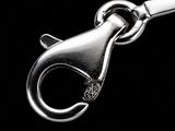 a close up of a metal object on a black background