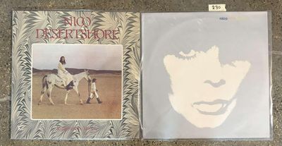 the album is on the floor next to a picture of a woman on a horse