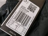 a label on the back of a pair of black pants