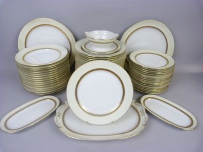 a lot of plates and bowls on the table