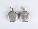 pair of antique silver pocket watches on white background with white background