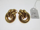 two pairs of gold toned earrings with a price tag on a white background