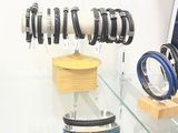 a display of bracelets and watches on display in a store