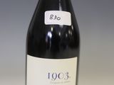a bottle of wine that is sitting on a table