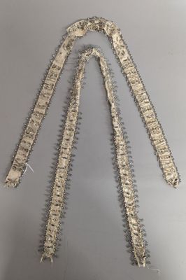 a close up of a metal chain on a gray surface