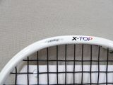 a close up of a tennis racket with a logo on it