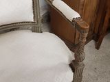 a chair that has a roll of toilet paper on it