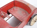 a red wooden toy car with a clock on the front