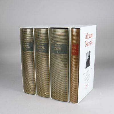 three books sitting on top of each other in front of a white box