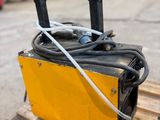 a close up of a piece of equipment on a pallet in a warehouse