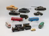 many different types of toy vehicles on display in a display case