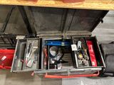 a tool box with tools inside of it on the floor
