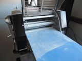 an image of a machine that is making a sheet of paper