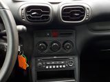 the dashboard of a car with a steering wheel and dashboard controls