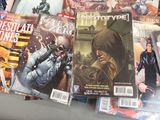 a lot of comic books sitting on a table