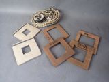 four wooden picture frames and a rope on a table