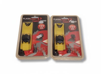 pair of yellow and black flashlights in plastic packaging on a white background