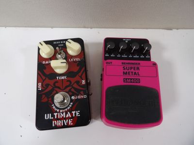 a couple of pedals sitting next to each other on top of a table