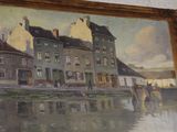 a painting on the wall of a building with a horse in front of it