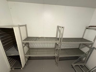 a room with shelves and shelves in it that are empty