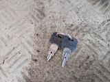 a couple of keys that are laying on the ground