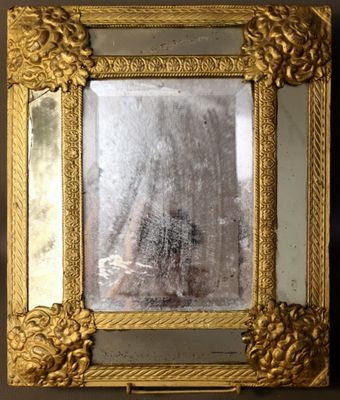 a picture of a gold frame with a mirror in it