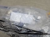 a plastic bag with a toothbrush and toothpaste inside of it