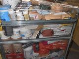 a man standing behind a cart full of food