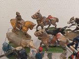 many figurines that are on display on a table