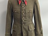 military uniform on a mannequin base with a red collar