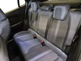 two seats in the back of a car with a remote control