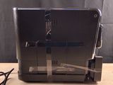a toaster that is sitting on a wooden table