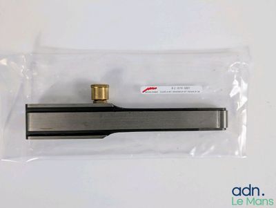 a close up of a metal object in a plastic bag on a table