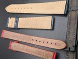 four different types of leather watch bands laid out on a table