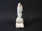 an image of a statue of a woman holding a baby in her arms