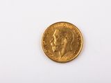 an image of a gold coin on a white surface