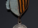 an image of a medal with a ribbon around it on a black background