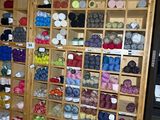 a room filled with lots of different colored yarns