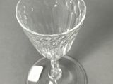 a wine glass that is sitting on a table