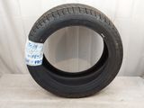a close up of a tire with a sticker on the side of it