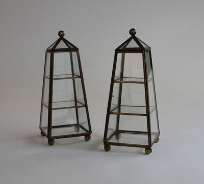 pair of brass and glass terrariums on casteors