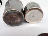 two salt and pepper shakers sitting on a table