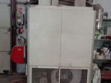 an image of a machine in a garage with a lot of stuff
